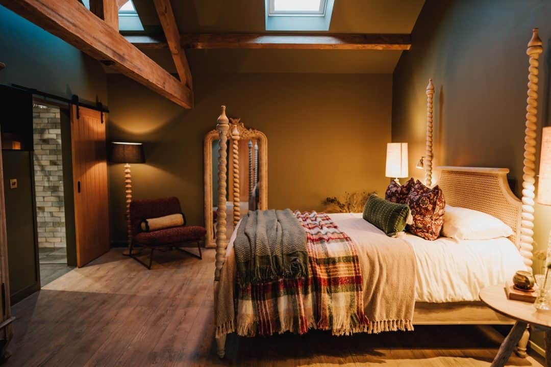 Warm colours, patterned textiles and a four-poster bed in Patty’s Croft