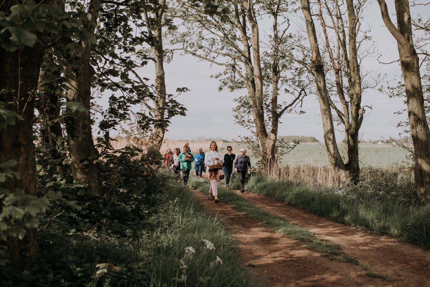A group following a woodland path at Patty’s Barn