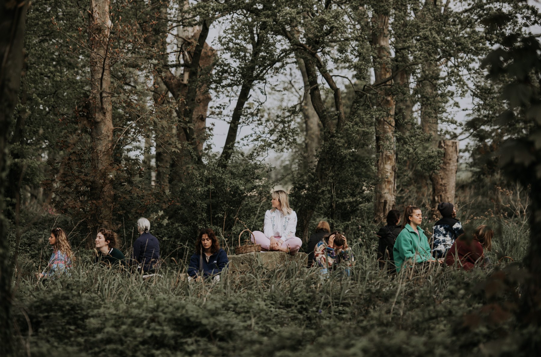 A group taking time for woodland meditation at Patty’s Barn