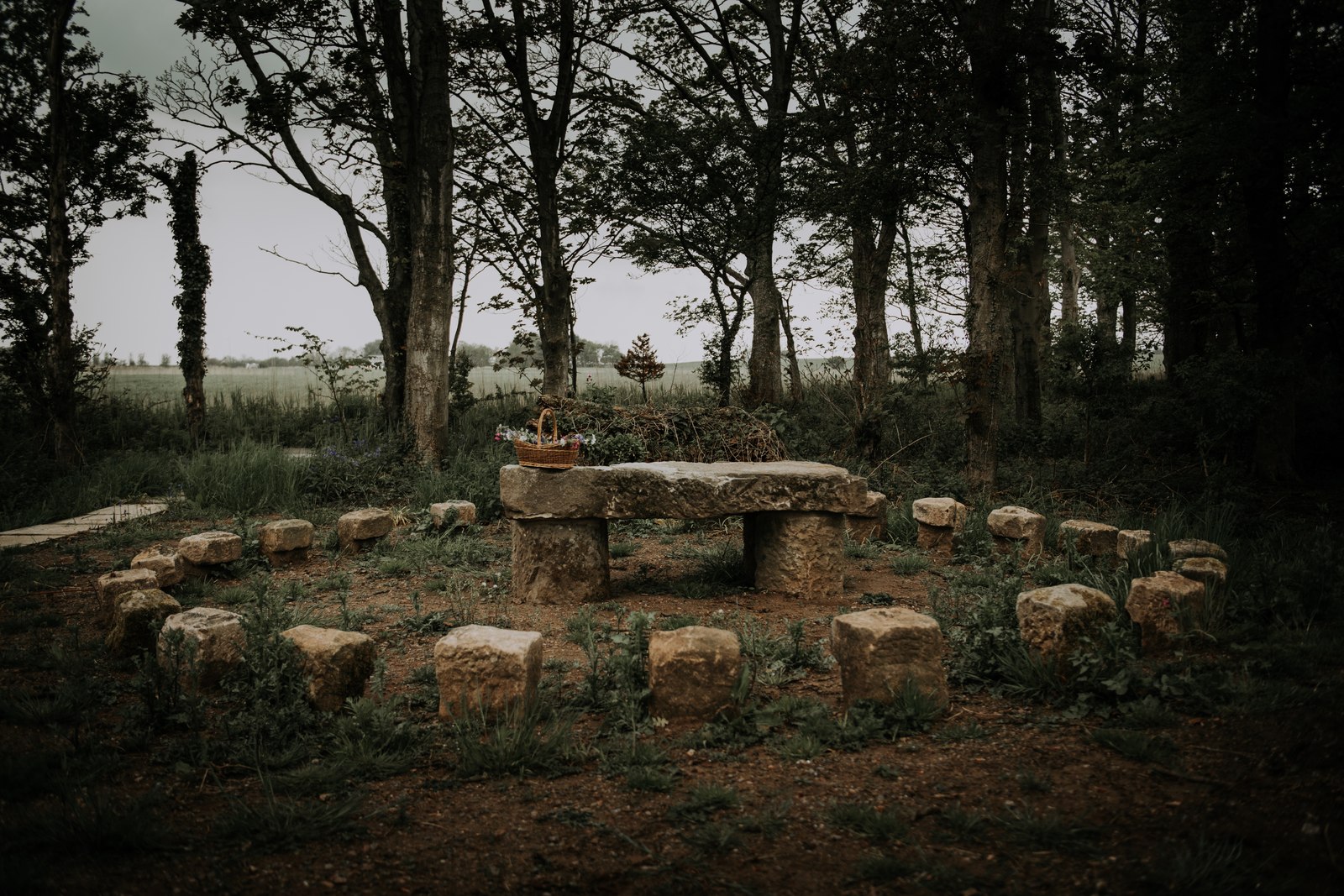The stone seating circle beneath the trees at Patty’s Barn